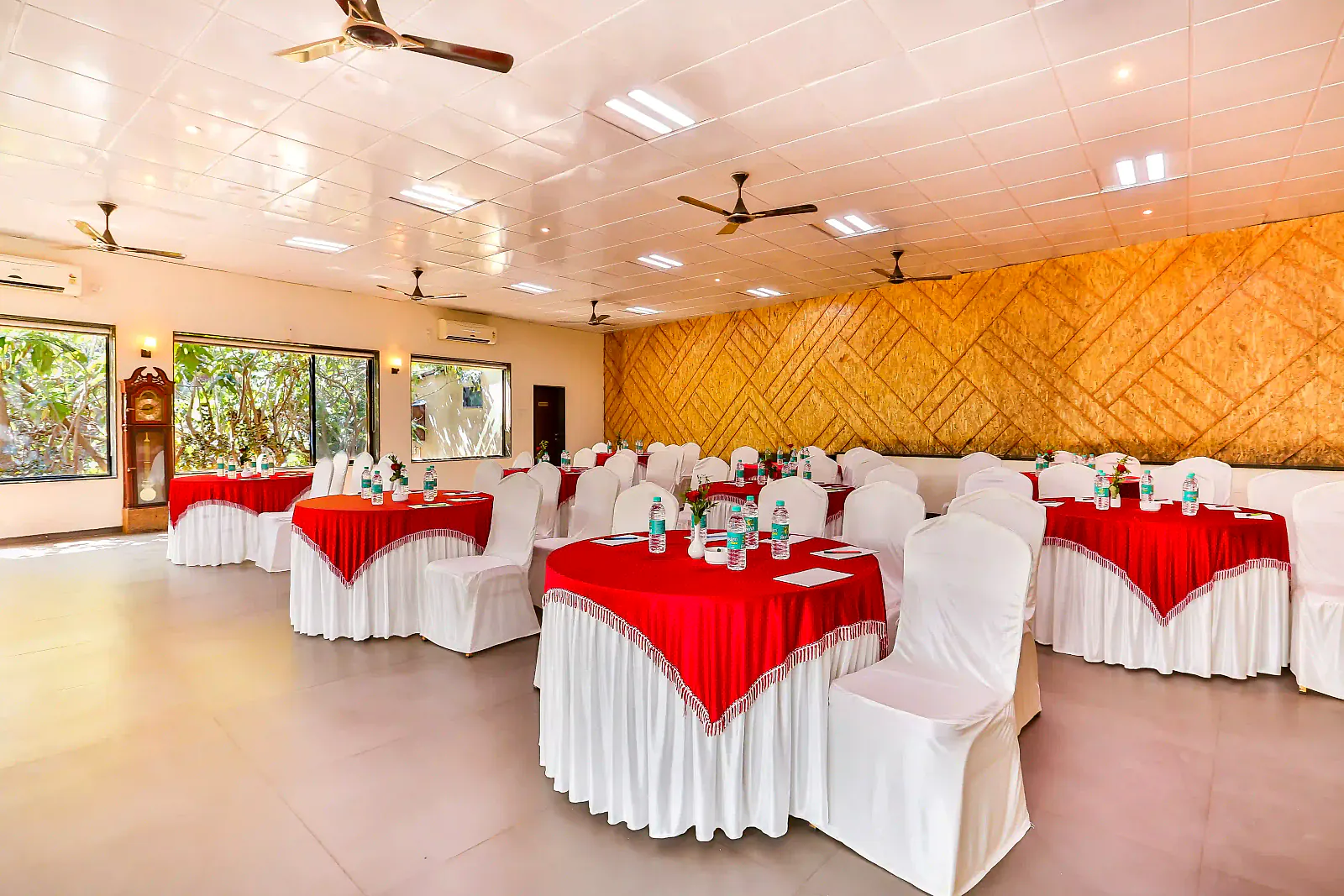 The banquet hall set with cluster seating and dressed tables