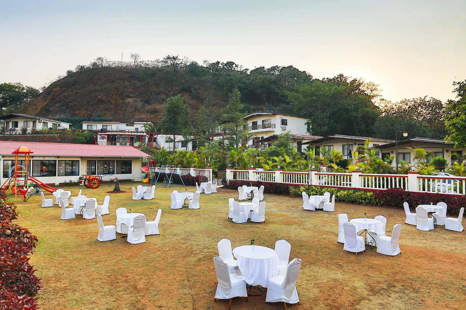 The open lawn at Cloud 9 Hills Resort with the hills beyond
