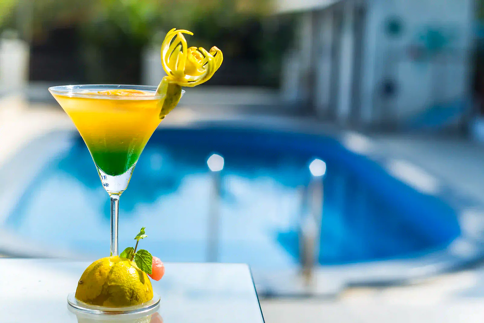 A layered mocktail by the pool