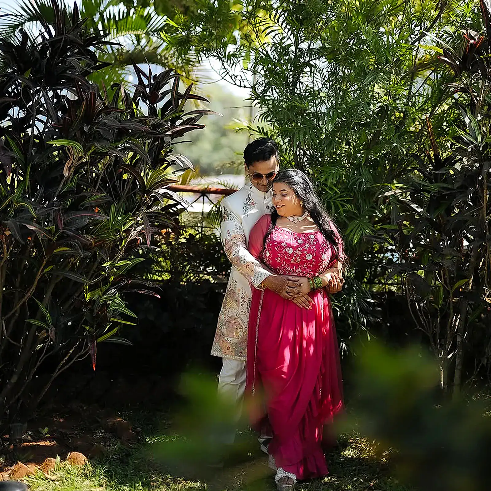 The couple in an embrace in the resort garden